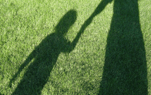 Shadow of Parent Holding Childs Hand